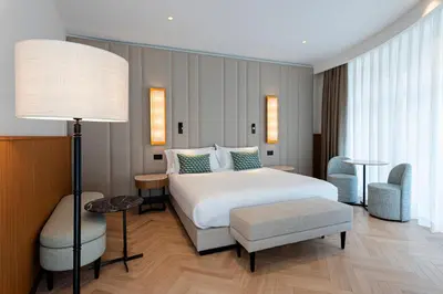 a bedroom with a bed and a table and a lamp at Circle6 Rome in Rome
