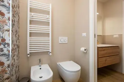 a small bathroom with a toilet and a sink at Aurelius Design Loft 2 in Rome