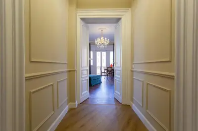 an empty hallway with a chandelier in a house at Elegance and Style near St Peter's in Rome