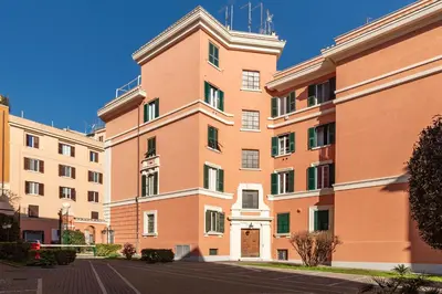 an empty street in a city with buildings at GuestHost - Terrace Apartment Nomentano - Roma in Rome
