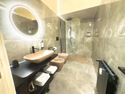 a bathroom with a sink and a toilet and a mirror at Pantheon Urbes Collection in Rome