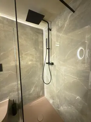 a shower with a glass door in a bathroom at Pantheon Urbes Collection in Rome