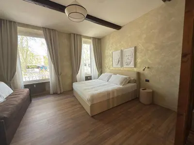 a bedroom with a bed and a large window at Pantheon Urbes Collection in Rome