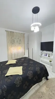 a bedroom with a large bed with a black blanket at Marconi House - A un passo da Trastevere in Rome