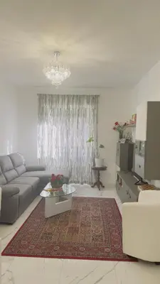 a living room with a couch and a table at Marconi House - A un passo da Trastevere in Rome