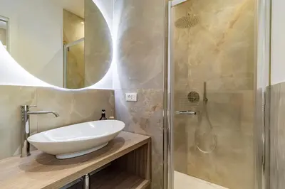 a bathroom with a sink and a shower at Cipro Vatican Luxury Escape in Rome