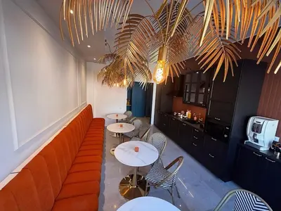 a restaurant with two tables and a couch at Cipro Vatican Luxury Escape in Rome