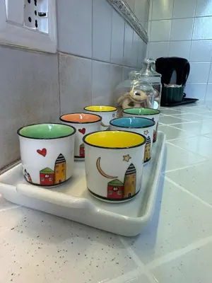 a tray with several bowls on top of a counter at 'Boh House' in Rome