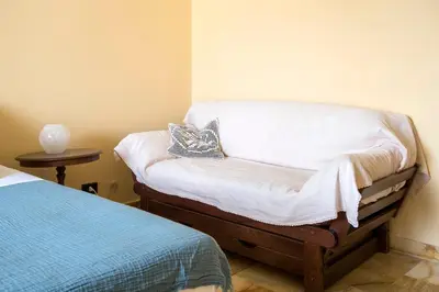 a small room with a bed and a pillow at Paramount Penthouse in Rome