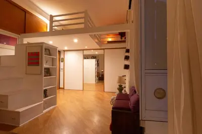 a living room with a loft bed and a couch at Domus Caroli in Vaticano in Rome