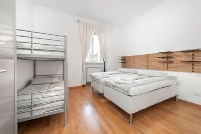 a bedroom with three bunk beds and a window at Irpini in Rome