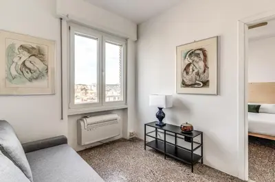 a living room with a couch and a window at Amazing Piramide Metro Station in Rome