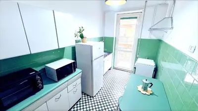 a small kitchen with a toy animal sitting on a bench at Domus Remo Room #2 in Rome