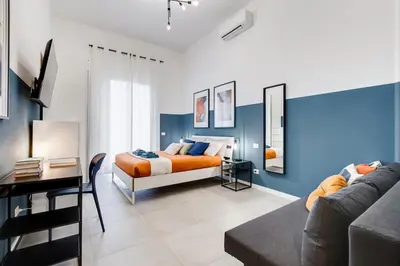 a bedroom with a bed and a couch at BDC - Stairway to Heaven in Rome