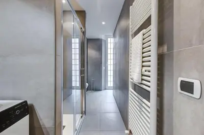 a bathroom with a walk in shower and a glass door at BDC - Stairway to Heaven in Rome