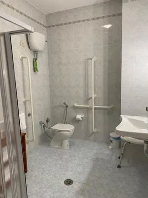a bathroom with a toilet and a sink at Casa per Ferie Suore Salesiane dei Sacri Cuori in Rome