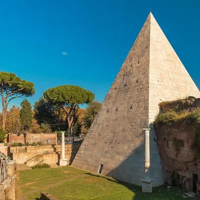 a pyramid in a park with trees in the background at Casa Laila in Rome
