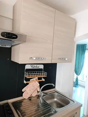 a kitchen counter with a sink and a sink at Jeb's Sweet Rooftop in Rome