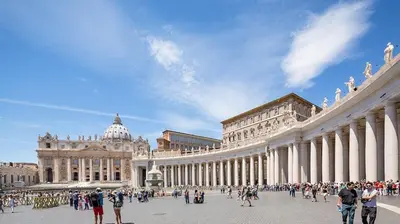 a large building with people walking in front of it at Apartment near the Vatican in Rome