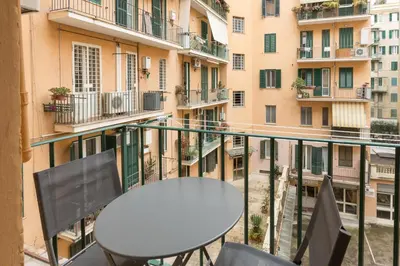 a table and chairs on the balcony of a building at Casa Minieri - Viale Mazzini - San Pietro in Rome