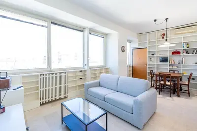 a living room with a couch and a table at Urban Haven Roma, Porta Maggiore in Rome