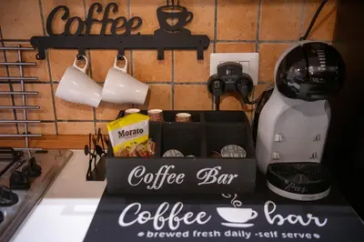 a coffee bar sign on a counter next to a mixer at Welcoming Vatican Garden Home - with Hot Hub in Rome