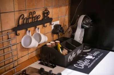 a kitchen counter with a black box on the wall at Welcoming Vatican Garden Home - with Hot Hub in Rome