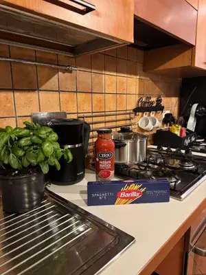 a kitchen counter with pots and pans on a stove at Welcoming Vatican Garden Home - with Hot Hub in Rome