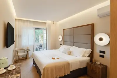 a bedroom with a large bed and a table at The Romex in Rome