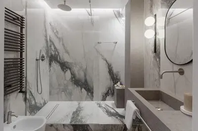 a white bathroom with a shower and a sink at The Romex in Rome