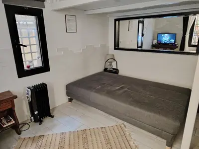 a bedroom with two beds and a bunk bed at Casetta indipendente Testaccio Roma Centro in Rome