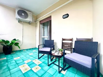 a room with a bed and chairs and a table at Gandino House at Vatican in Rome