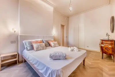 a bedroom with a large bed in a room at Gianicolo Suites in Rome