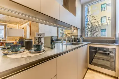 a kitchen with a counter with two mugs on it at Gianicolo Suites in Rome