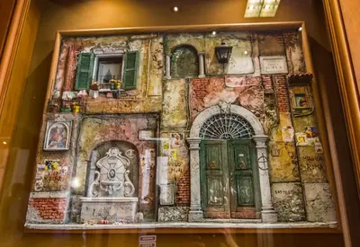 a painting of a building with two doors at Hotel Verona Rome in Rome