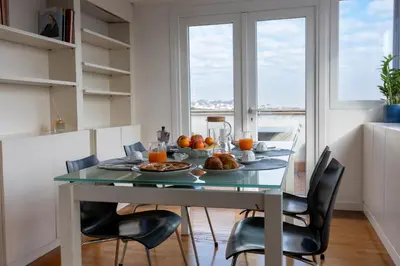 a dining room table with breakfast foods on it at Centrale Attico vista Magnifica sul Vaticano in Rome
