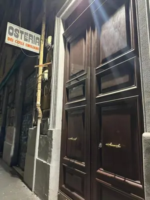 a large wooden door on the side of a building at Retroflatsanlorenzo in Rome