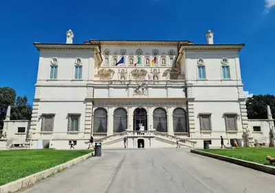 a large white building with people walking around it at Loft at Ponte Milvio in Rome