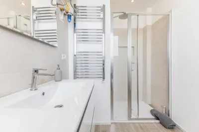 a bathroom with a white tub and a shower at Domus Urbe Piramide in Rome