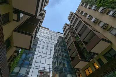 a view of two tall buildings in a city at Trastevere Luxury Apartment in Rome