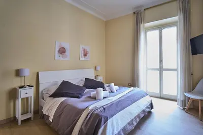 a bedroom with a bed with two towels on it at Superior Vatican suite Key Apartment in Rome