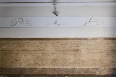 a statue of three men on the side of a building at Superior Vatican suite Key Apartment in Rome