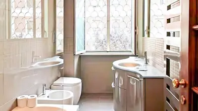 a kitchen with two pots on top of a stove at Superior Vatican suite Key Apartment in Rome