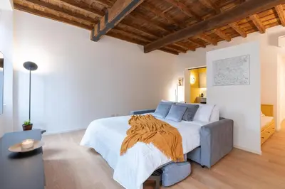 a bedroom with a large bed in a room at Sotto al letto del Papa - Borgo Pio - Vaticano in Rome