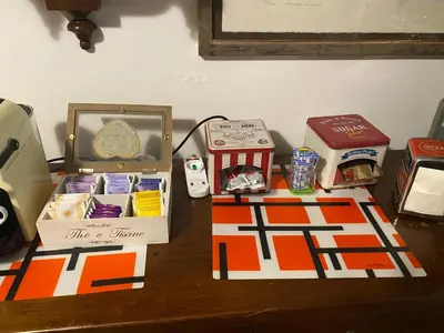 a table topped with boxes of food and other items at A casa di Simone in Rome