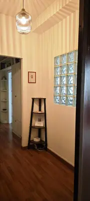a room with a shelf and a window and a ladder at San Peter's Gates in Rome