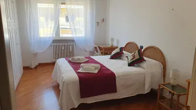 a bedroom with a bed with two towels on it at Attico Balduina in Rome