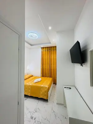 a bedroom with a bed and a television in it at Casa Roma in Rome