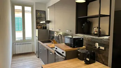 a kitchen with a sink and a counter with a microwave at RM 191 - La Tua Casa lontano da Casa in Rome
