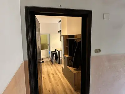 a hallway with a door open to a dining room at RM 191 - La Tua Casa lontano da Casa in Rome